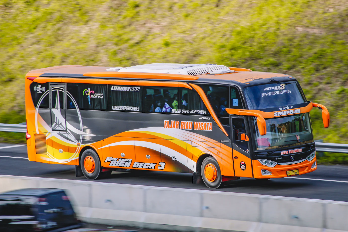 Orange coach bus on a highway with AI damage detection boxes