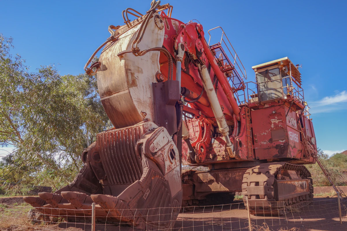 Worn mining excavator photographed for a remote claim survey