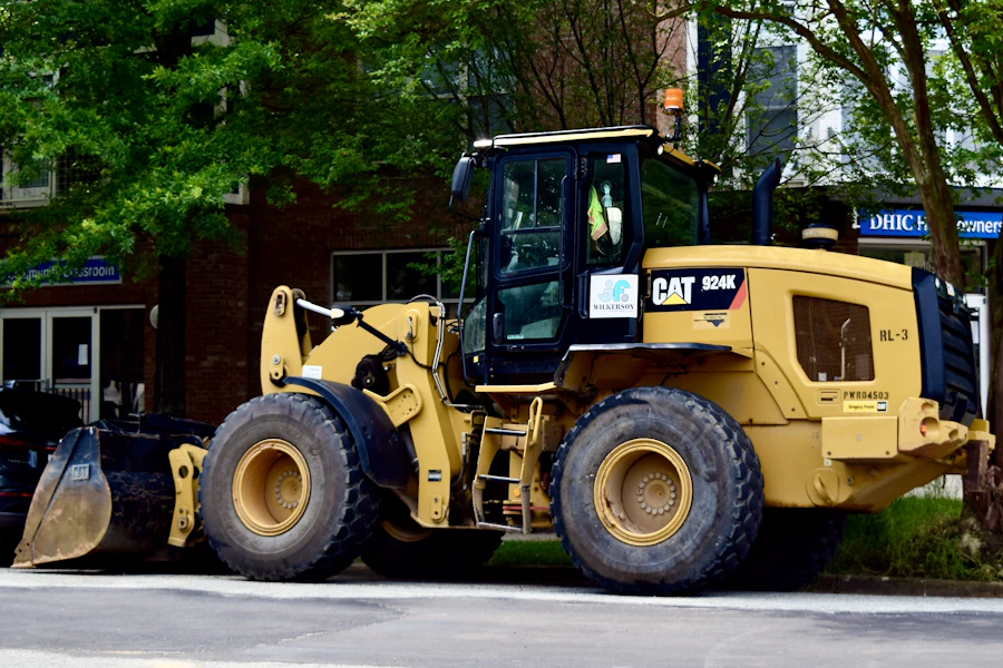 Yellow wheel loader parked on a street